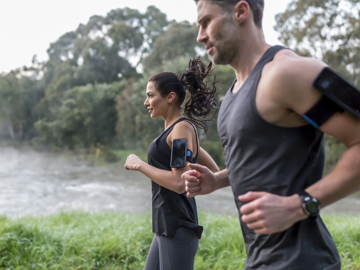 runners in stride with quad lock running armband for samsung galaxy smartphones