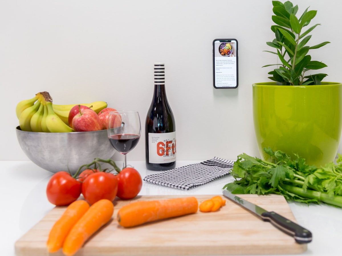 Smartphone Attached to Wall in Kitchen