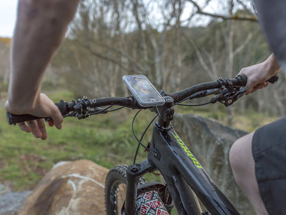 mountain bike rider using weather resistant slip on cover