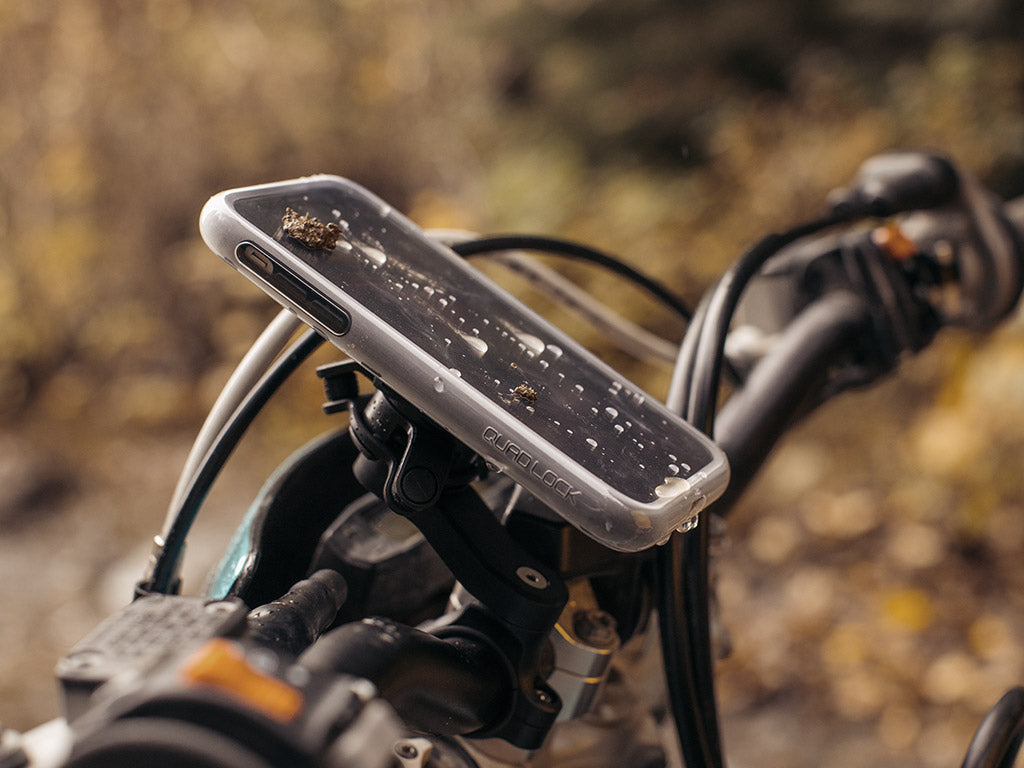 quad lock poncho on motorbike handlebar mount