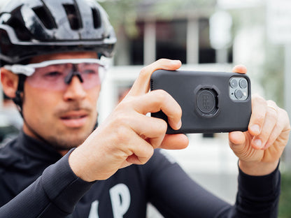 rider takes photo with iphone 11 pro and quad lock case