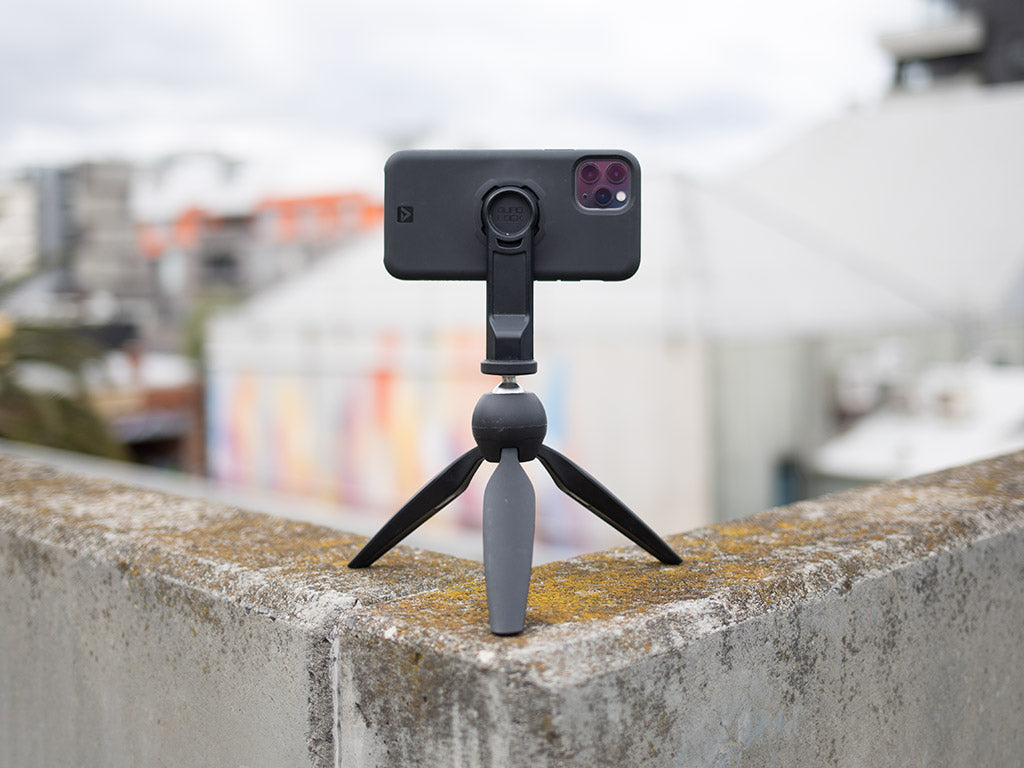 iphone 11 pro attached to quad lock tripod adaptor