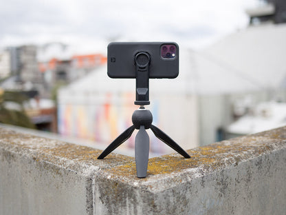 iphone 11 pro attached to quad lock tripod adaptor